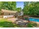 Lush backyard featuring a pool, deck and plenty of green space at 3307 Pointe Bleue Ct, Decatur, GA 30034
