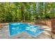 Inviting backyard pool with clear blue water and poolside area at 3307 Pointe Bleue Ct, Decatur, GA 30034