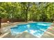 Backyard with a sparkling swimming pool and outdoor lounge area at 3307 Pointe Bleue Ct, Decatur, GA 30034