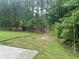 Private backyard with mature trees, outbuilding and a peaceful setting at 5022 Cliff Top Dr, Loganville, GA 30052