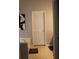 Neutral bathroom with a white door, white bathtub and beige tile floor at 5022 Cliff Top Dr, Loganville, GA 30052