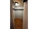 Walk-in closet with wood flooring and hanging racks at 5022 Cliff Top Dr, Loganville, GA 30052