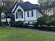 Beautiful two-story home with well-maintained lawn, dark accents, and mature landscaping at 5022 Cliff Top Dr, Loganville, GA 30052