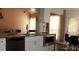 Modern kitchen with stainless steel appliances, sleek countertops, and ample cabinet space at 5022 Cliff Top Dr, Loganville, GA 30052