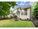 Charming backyard featuring a spacious deck with stairs leading down to a well-manicured lawn at 6790 Wolford Ct, Johns Creek, GA 30097