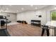 Spacious basement with barstool seating, workout equipment, and modern decor at 6790 Wolford Ct, Johns Creek, GA 30097