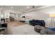 Wide open finished basement with a partial kitchen, gym, and comfortable seating area at 6790 Wolford Ct, Johns Creek, GA 30097