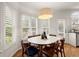 Charming dining area with a modern light fixture and plenty of natural light at 6790 Wolford Ct, Johns Creek, GA 30097