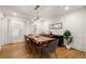 Bright dining room features wood floors, modern lighting, and stylish décor at 6790 Wolford Ct, Johns Creek, GA 30097
