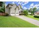 Charming two-story home with a well-manicured lawn and inviting curb appeal in a desirable neighborhood at 6790 Wolford Ct, Johns Creek, GA 30097