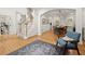 Spacious foyer with hardwood floors, staircase, and arched doorway leading to the dining area at 6790 Wolford Ct, Johns Creek, GA 30097