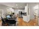Modern kitchen featuring a large island with granite countertops, stainless steel appliances, and white cabinetry at 6790 Wolford Ct, Johns Creek, GA 30097
