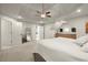 Spacious main bedroom with tray ceiling, and carpeted floors at 6790 Wolford Ct, Johns Creek, GA 30097