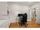 Dedicated home office with built-in shelving, desk, and natural light, ideal for remote work at 6790 Wolford Ct, Johns Creek, GA 30097