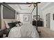 Serene main bedroom featuring a four-poster bed, neutral color palette, and contemporary furnishings at 12 Jacobs Farm Ln # 6, Lawrenceville, GA 30045