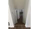 A view down the stairs into the basement of a home showing the door and the basement floor at 1247 Shoreham Dr, Atlanta, GA 30349