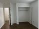 Empty closet with shelving in bright bedroom featuring wood-look floors at 1247 Shoreham Dr, Atlanta, GA 30349