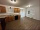 Well-lit kitchen offers ample counter space, wood cabinetry, and modern appliances at 1247 Shoreham Dr, Atlanta, GA 30349