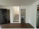Spacious living room with new vinyl floors provides entrance to staircase and other living areas at 1247 Shoreham Dr, Atlanta, GA 30349