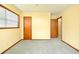 Neutral bedroom featuring carpet flooring and closet and doorway entrances at 1303 Cochise Cir, Austell, GA 30168