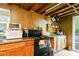 Rustic kitchen with an oven, microwave and open shelving at 1303 Cochise Cir, Austell, GA 30168