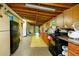 Rustic kitchen featuring wooden cabinets, appliances, and an open layout at 1303 Cochise Cir, Austell, GA 30168