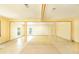 Large, open living room featuring tile flooring and neutral paint to create a bright space at 1303 Cochise Cir, Austell, GA 30168