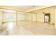 Spacious living area with tile flooring, neutral walls, and ample natural light through window at 1303 Cochise Cir, Austell, GA 30168