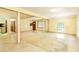 Open living area with tile flooring, light walls, and flexible space for multiple furniture arrangements at 1303 Cochise Cir, Austell, GA 30168