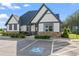 Attractive clubhouse exterior features manicured landscaping, stone accents, and convenient parking at 221 Begonia Way, Mcdonough, GA 30253
