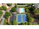 Aerial view of tennis courts and a swimming pool in a gated community at 3143 Denton Ne Pl, Roswell, GA 30075