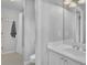 Neutral bathroom offering a tub and shower, and a vanity with generous counterspace and fixtures at 3143 Denton Ne Pl, Roswell, GA 30075