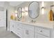 Elegant bathroom featuring a double sink vanity with quartz countertop and modern lighting at 3143 Denton Ne Pl, Roswell, GA 30075