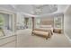 Spacious main bedroom with tray ceiling, sitting area, and large windows for ample natural light at 3143 Denton Ne Pl, Roswell, GA 30075