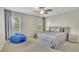 Comfortable bedroom featuring a cozy beanbag chair and large windows at 3143 Denton Ne Pl, Roswell, GA 30075