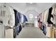 Large walk-in closet with ample hanging space and shoe storage at 3143 Denton Ne Pl, Roswell, GA 30075