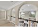 This hallway features arches, decorative lighting, and a view of the living room at 3143 Denton Ne Pl, Roswell, GA 30075