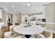 This eat-in kitchen features bright lighting, stainless appliances and an island cooktop at 3143 Denton Ne Pl, Roswell, GA 30075
