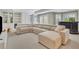Spacious living room with a large sectional sofa and ample natural light at 3143 Denton Ne Pl, Roswell, GA 30075