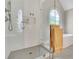 Modern shower features glass enclosure, white tile, and shower niche for bathroom essentials at 3143 Denton Ne Pl, Roswell, GA 30075