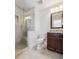 Elegant bathroom with a glass-enclosed shower, granite countertop, and modern fixtures at 320 Harvest View Ter, Woodstock, GA 30188