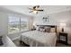 Comfortable bedroom with a ceiling fan, natural light, and stylish furnishings at 320 Harvest View Ter, Woodstock, GA 30188