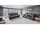 Home theater with plush seating, multiple windows and neutral carpeting at 320 Harvest View Ter, Woodstock, GA 30188