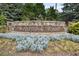 Stone sign for Woodstock Knoll neighborhood in a beautiful setting at 320 Harvest View Ter, Woodstock, GA 30188