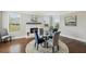 Cozy dining area with fireplace, natural light, and seating for six at 320 Harvest View Ter, Woodstock, GA 30188