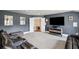 Media room with comfortable seating, and dark gray walls at 320 Harvest View Ter, Woodstock, GA 30188