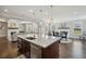 Spacious kitchen island with sink and stainless steel dishwasher in an open living space at 320 Harvest View Ter, Woodstock, GA 30188