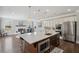 Bright eat-in kitchen features stainless steel appliances and granite countertops at 320 Harvest View Ter, Woodstock, GA 30188
