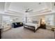 Spacious main bedroom featuring a tray ceiling, accent lights, and lots of natural light at 320 Harvest View Ter, Woodstock, GA 30188