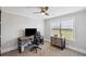 Home office with a ceiling fan, natural light, and comfortable furnishings at 320 Harvest View Ter, Woodstock, GA 30188